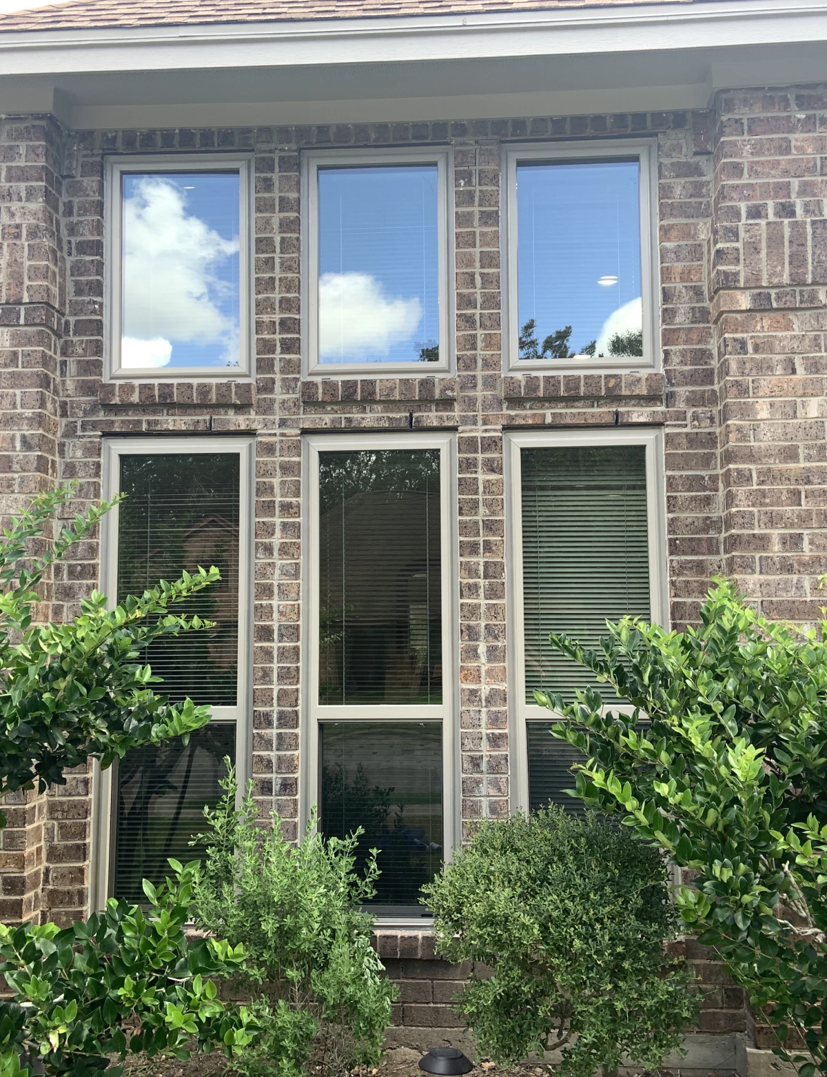 Sunny day reflecting on house windows